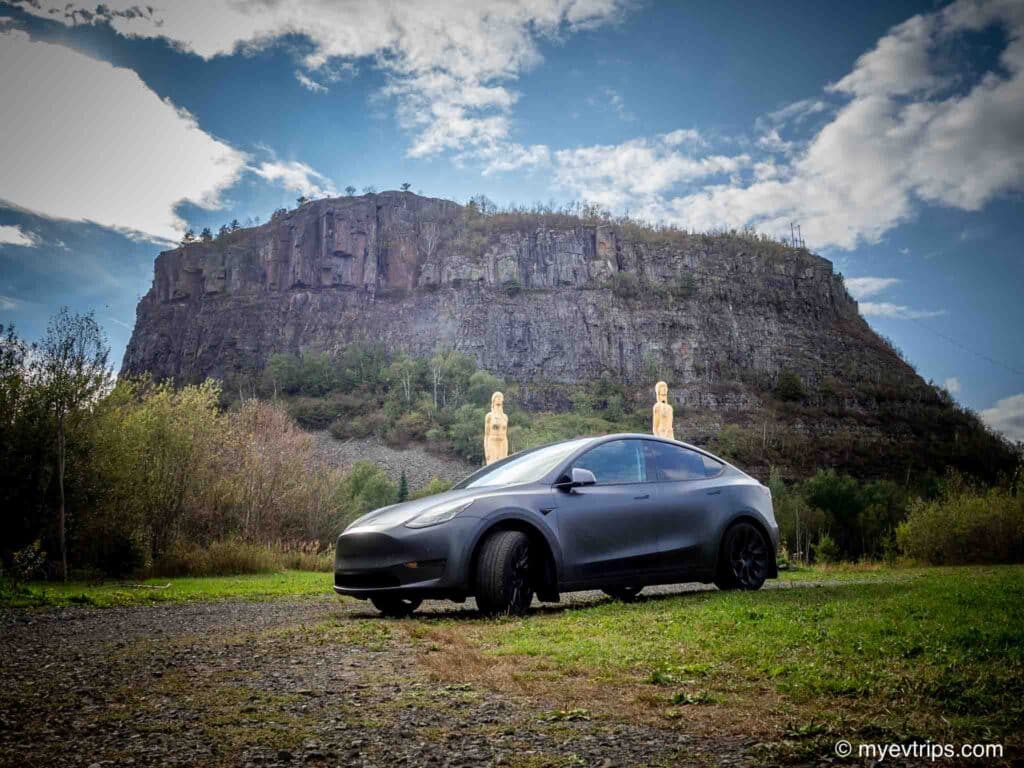 Tesla Model Y parked in front of Mount McKay Ontario