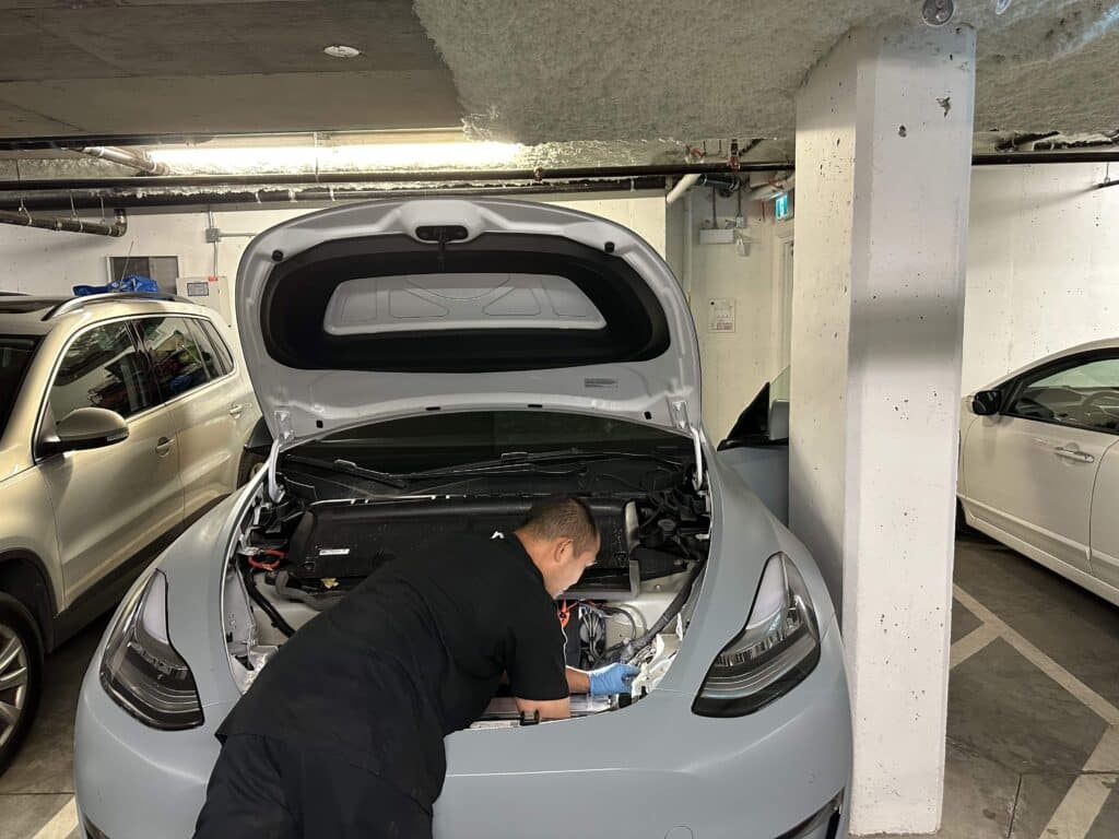 Tesla Homelink Installation in the front of a Model Y parked in a garage