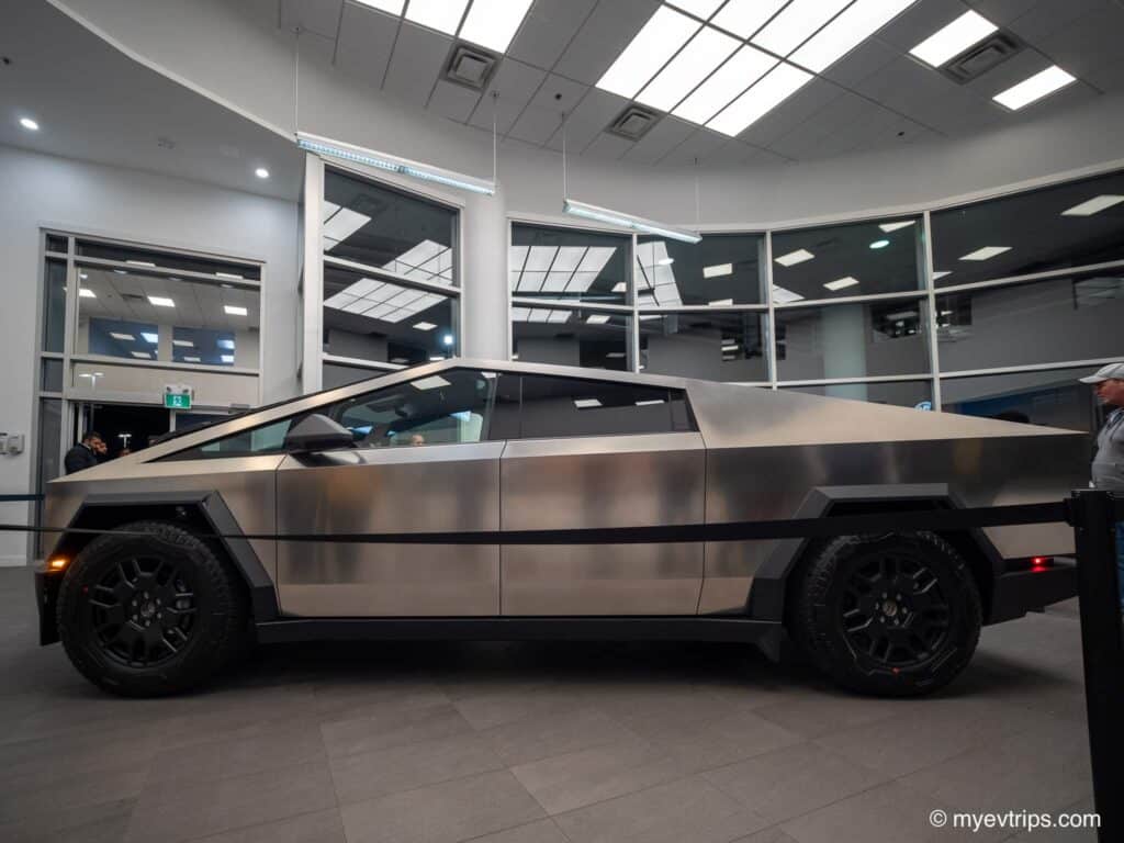 tesla cybertruck canada display model from the side behind a rope