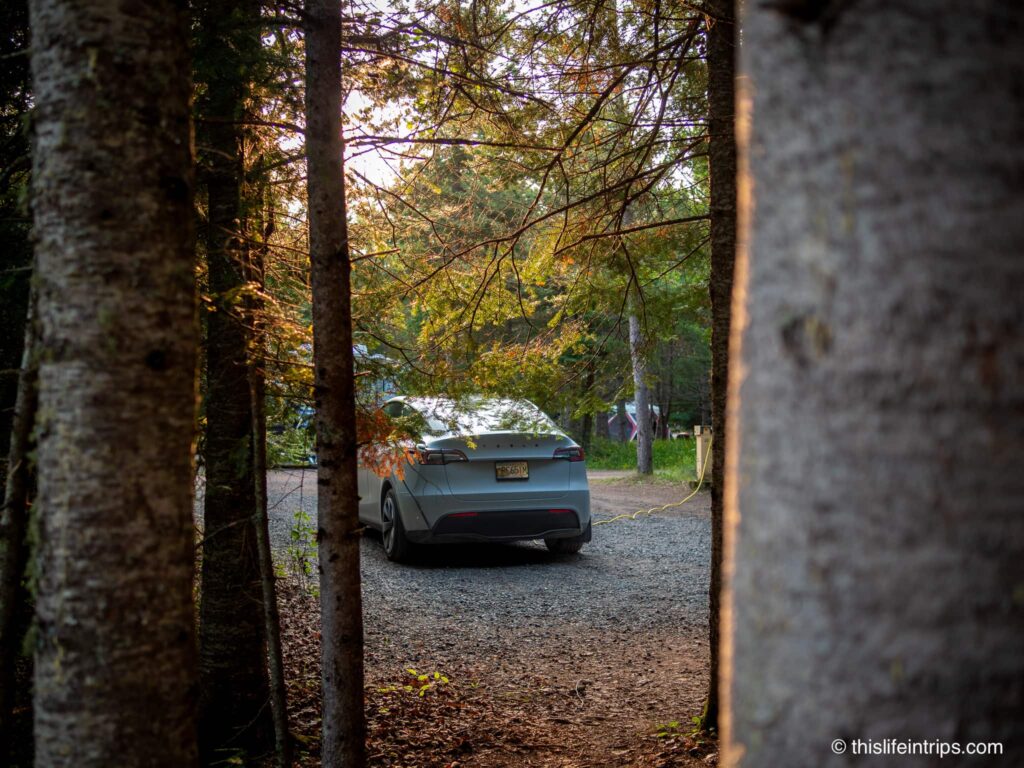Tesla Model Y charging at a camp site