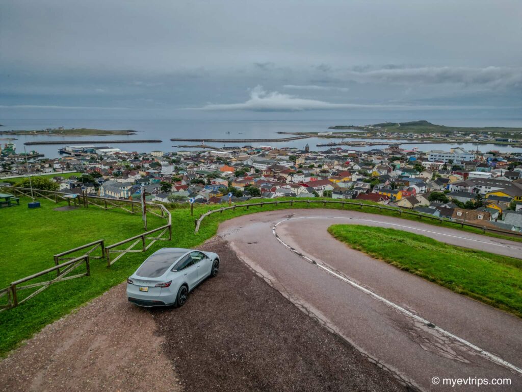 Tesla Model Y Driving to Saint Pierre in an EV overlooking the town