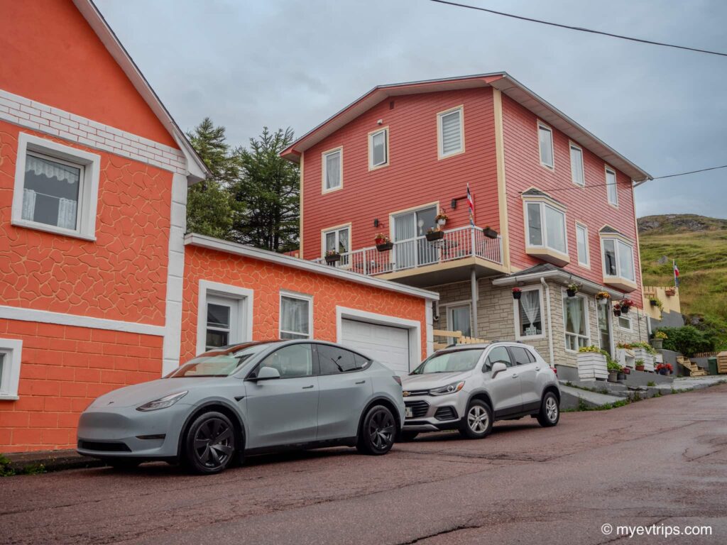 Tesla Model Y parked in front of Chez Marie Jo in Saint Pierre