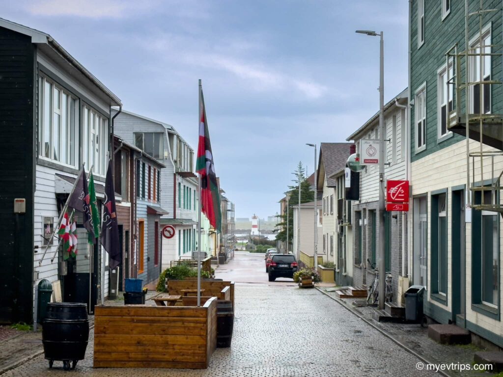 empty street in Saint Pierre with lighthouse in distance