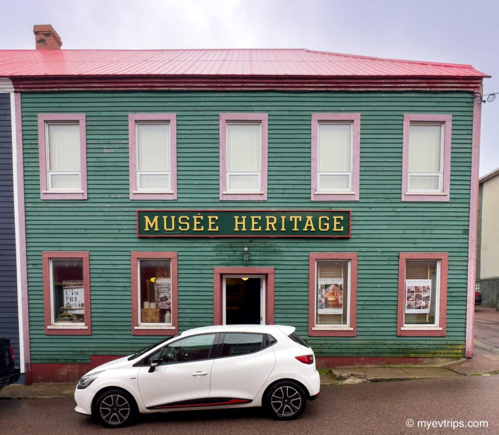 Musee Heritage exterior with white car parked in front
