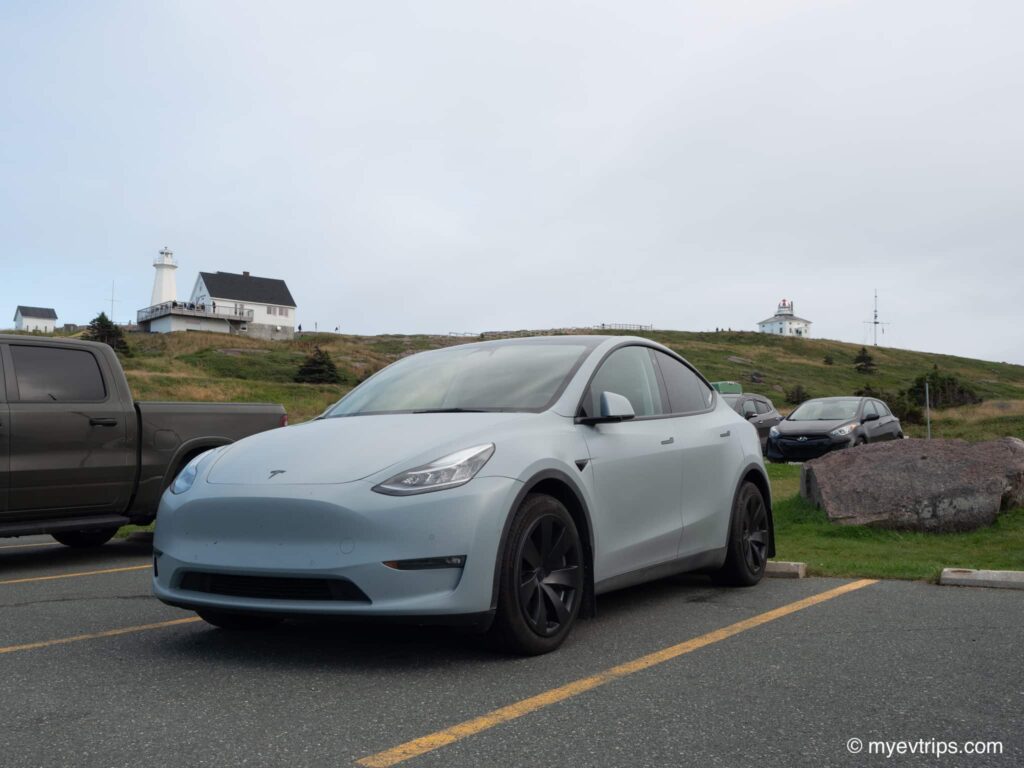 A Tesla Model Y parked at Cape Spear parking lot