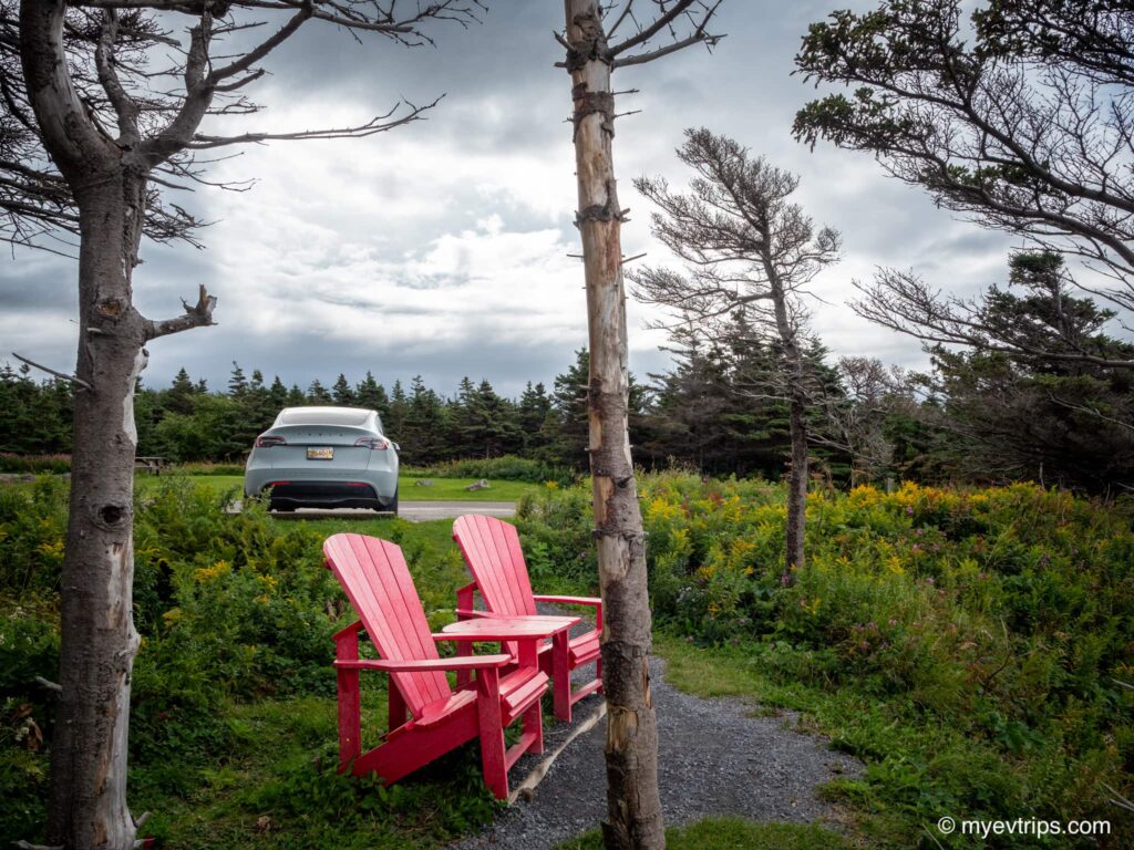 Red chairs at beach in Gros Morne Park Newfoundland