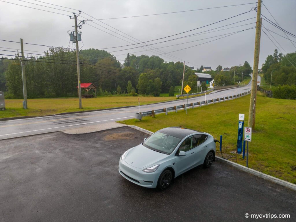 Tesla Model Y on Cote Nord road trip charging at Longue-Rive