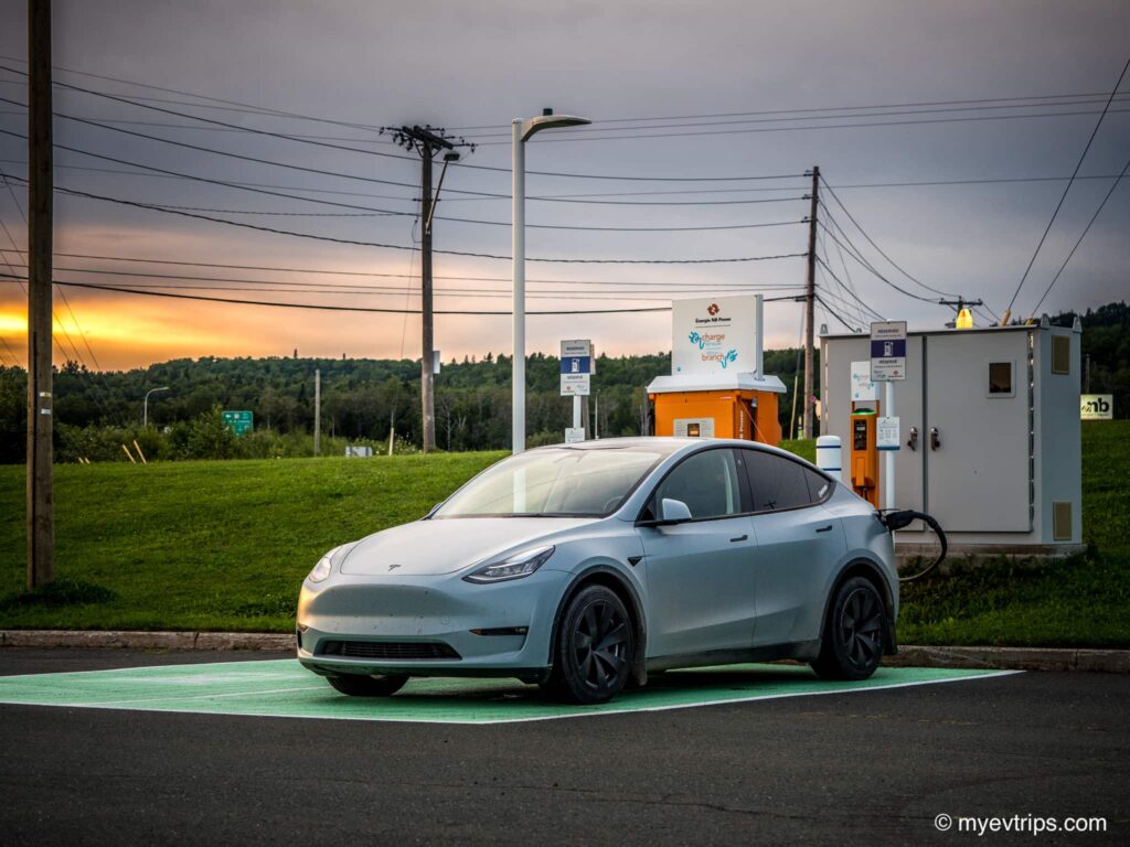 Tesla Model Y charging at a NB Power charging station on a New Brunswick Road Trip