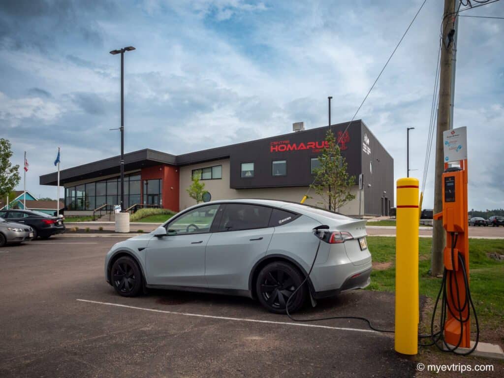 Tesla Model Y charging at Shediac lobster museum on a New Brunswick road trip