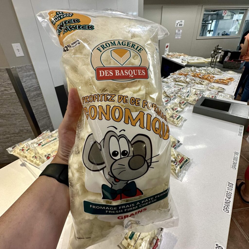 Hand hold large bag of cheese curds