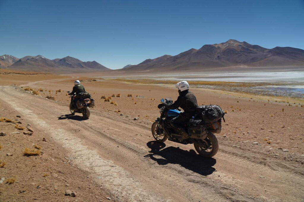 Long Way Up bikes driving on dirt road in South America