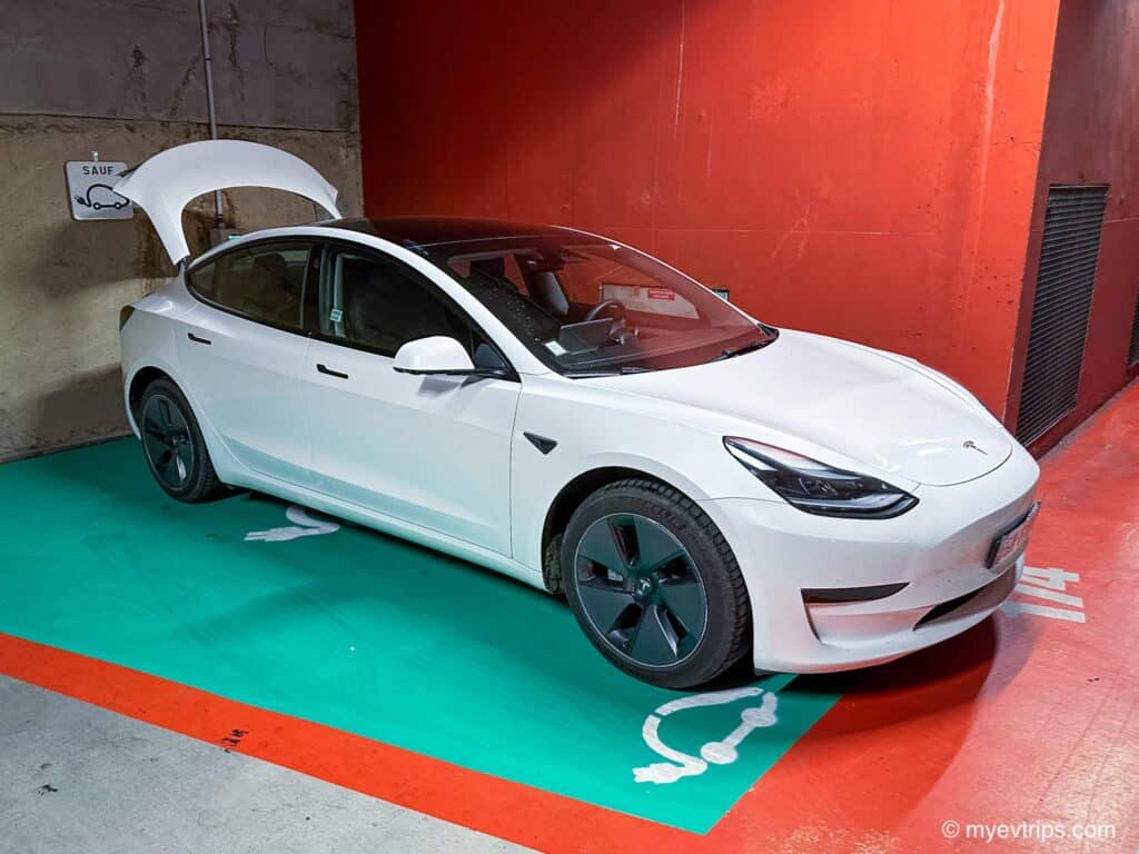 Tesla Model 3 at a parkade EV Chargers in France