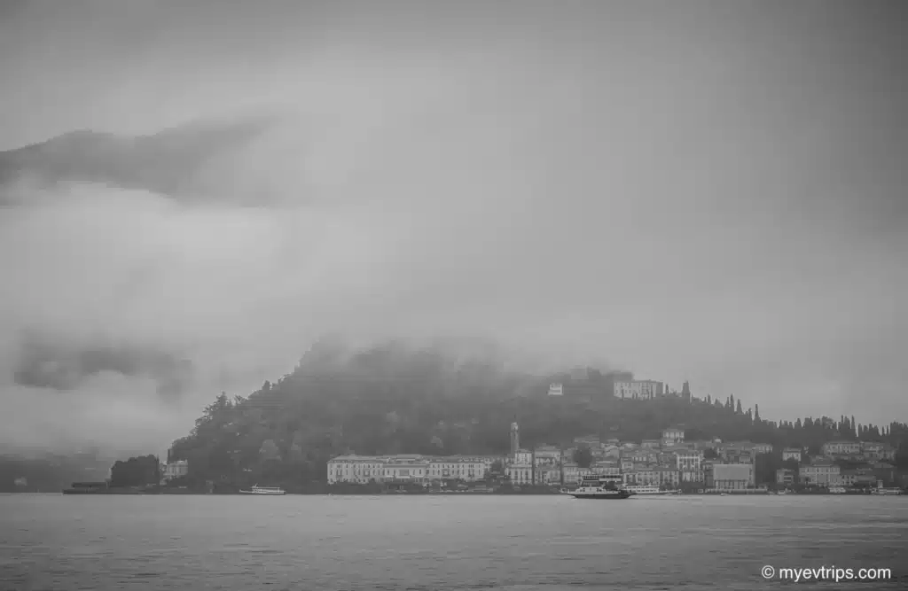 Lake Como Italy on a grey rainy day with ferry in the distance