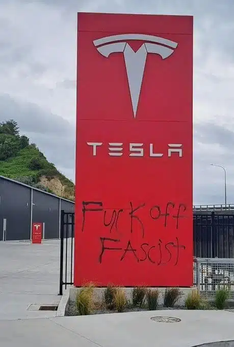 "Fuck off Fascist" spray painted on a Tesla sign in Wellington NZ, backlash from Elon Musk nazi salute.