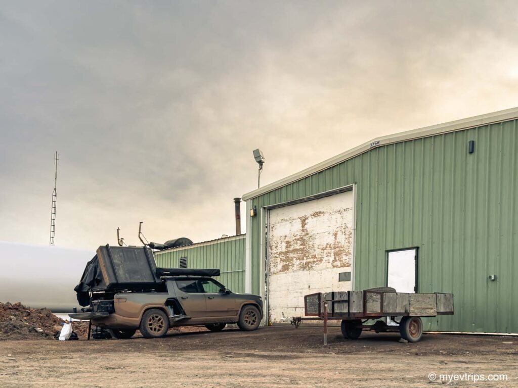 Rivian R1 camping at the Eagle Plains L2 charger