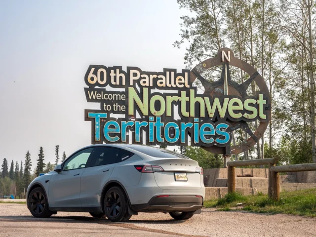 Memories came flooding back at the NWT border sign! 🌲⚡ Returning to the Northwest Territories in an EV where I grew up was surreal. As a child, I traveled this route with my father, towing boats on gravel roads—now I’m cruising in a Tesla Model Y. A truly unique and personally rewarding moment. 
.
.
Read the full EV road trip story at myevtrips.com 🚗💨
.
.
#EVroadtrip #SpectacularNWT #NWT #Tesla #TeslaModelY #ModelY #EV #EVroadtrip